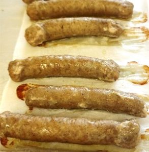 Breakfast sausages on a baking tray in the Food Technology Lab. 