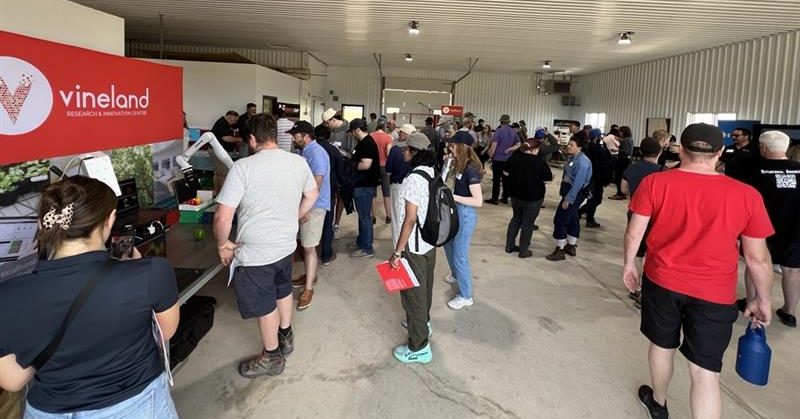 Group of people at an event in an industrial setting.